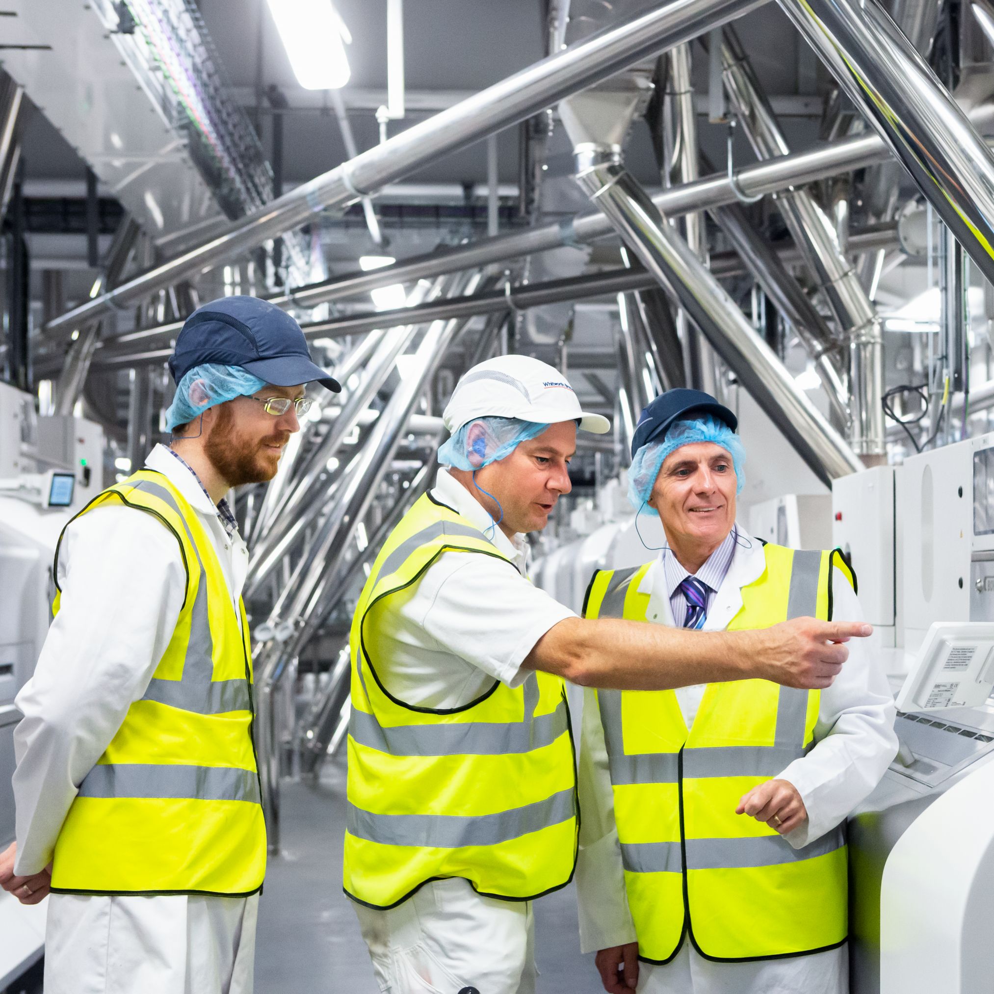 William Butler, Project Manager, Andrew Thomson and Mike Peters of Whitworth Bros. Ltd. review the processing data on the Arrius integrated grinding system.