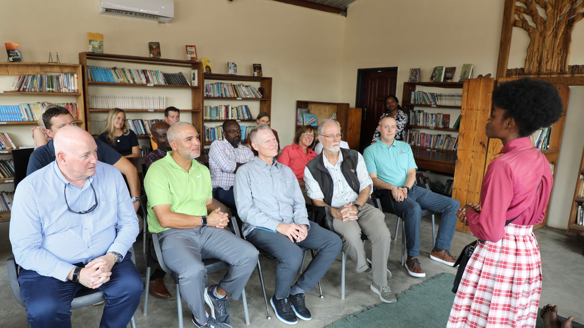 Bühler North America President & CEO Andy Sharpe (far left) with other members of the PFS Board listen to a presentation during their recent visit to Zambia.  