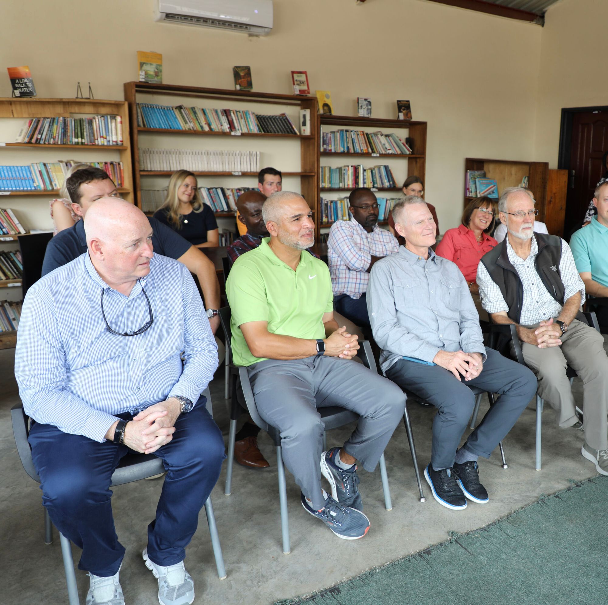 Bühler North America President & CEO Andy Sharpe (far left) with other members of the PFS Board listen to a presentation during their recent visit to Zambia.  