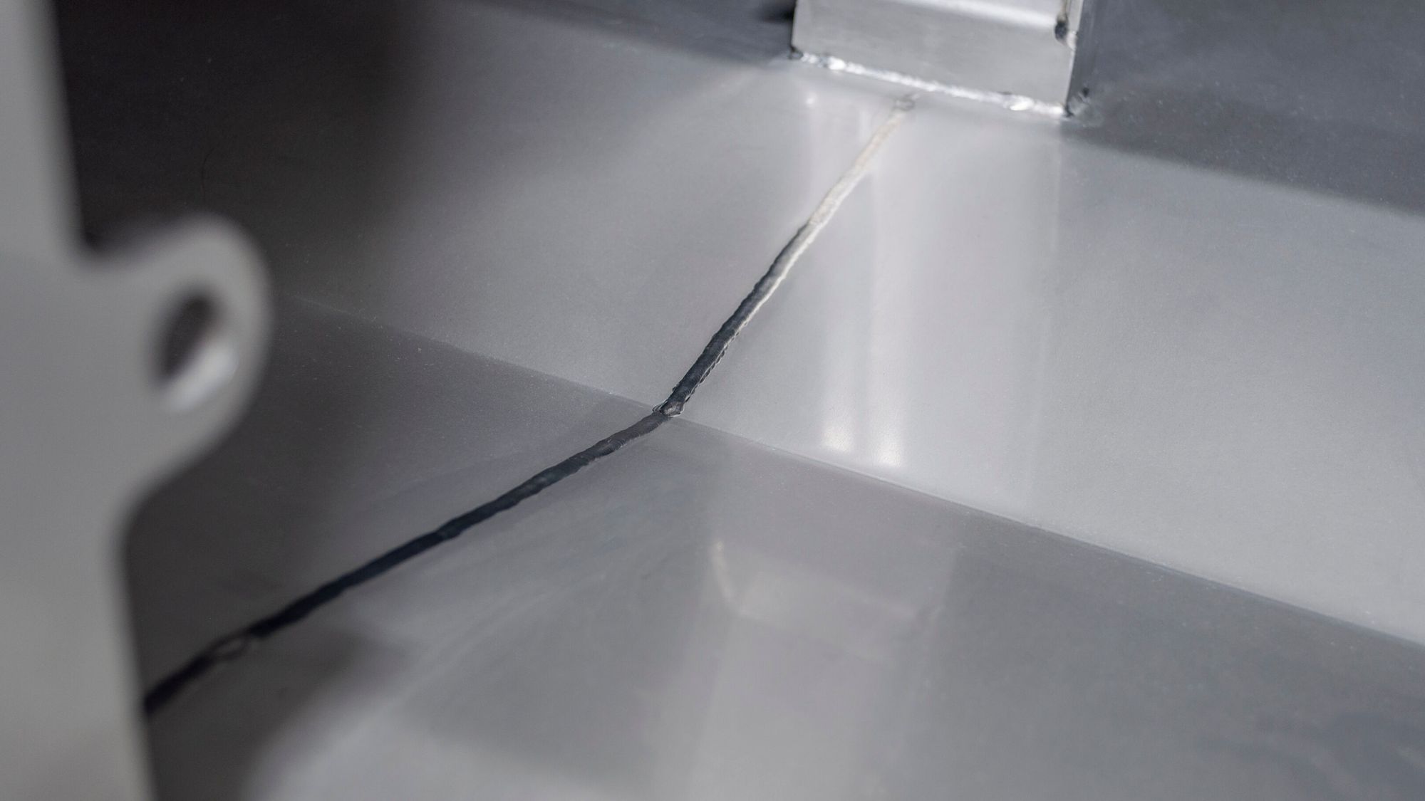 Continuous floor weld in dryer