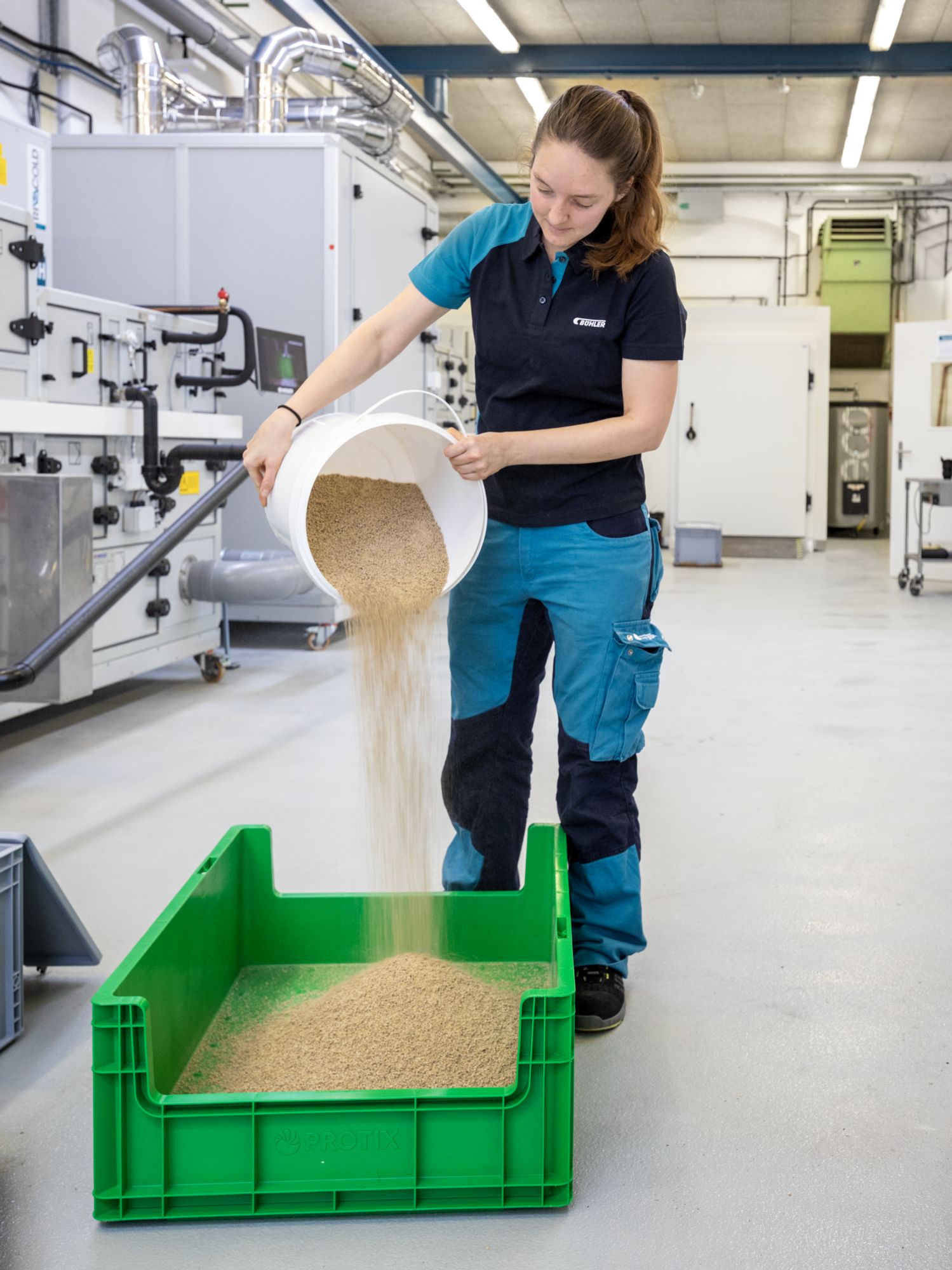 Jessica Wild mixes the exact amount of feed substrate for the larvae.