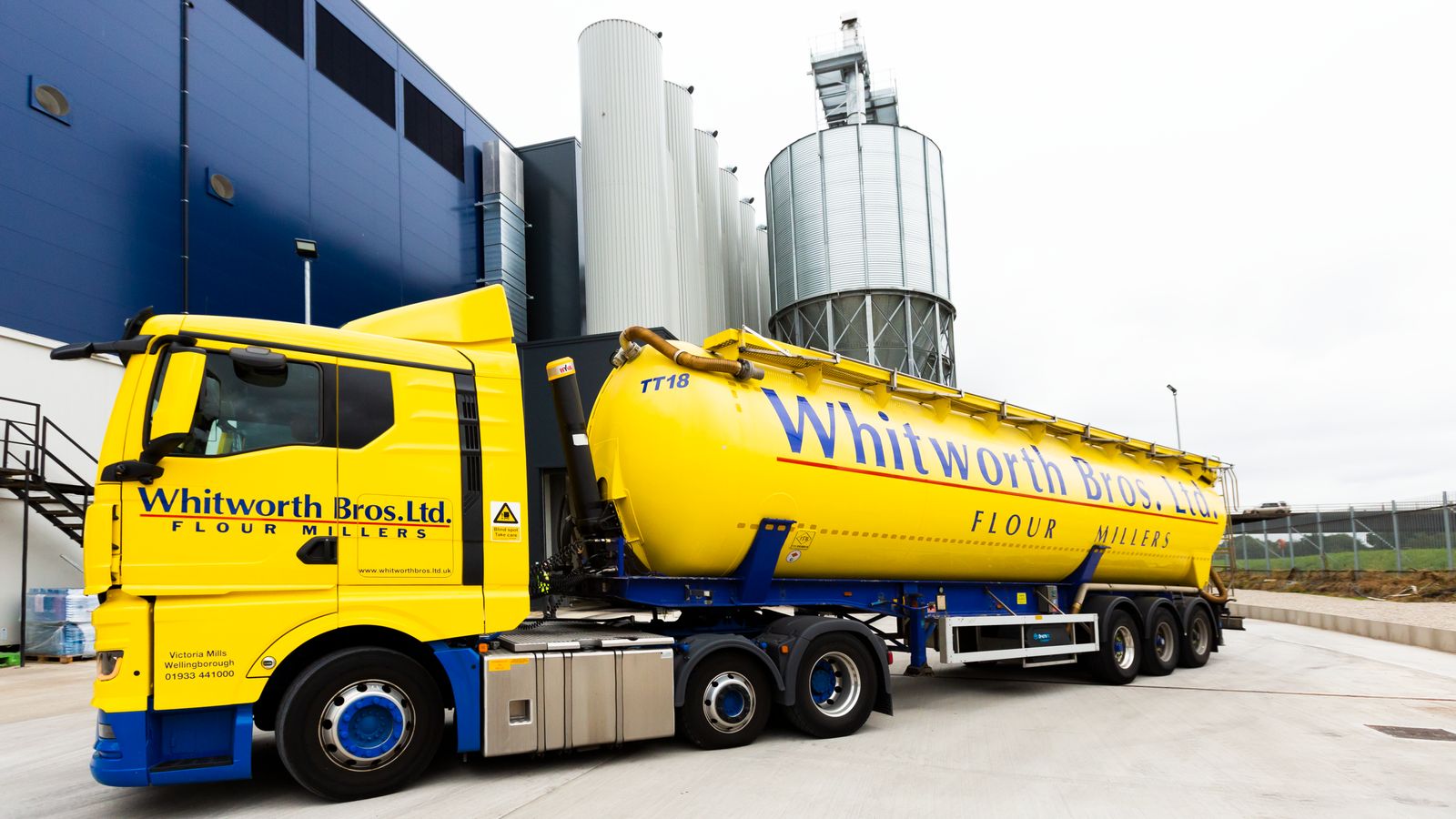 Whitworth Bros' yellow bulk tanker.
