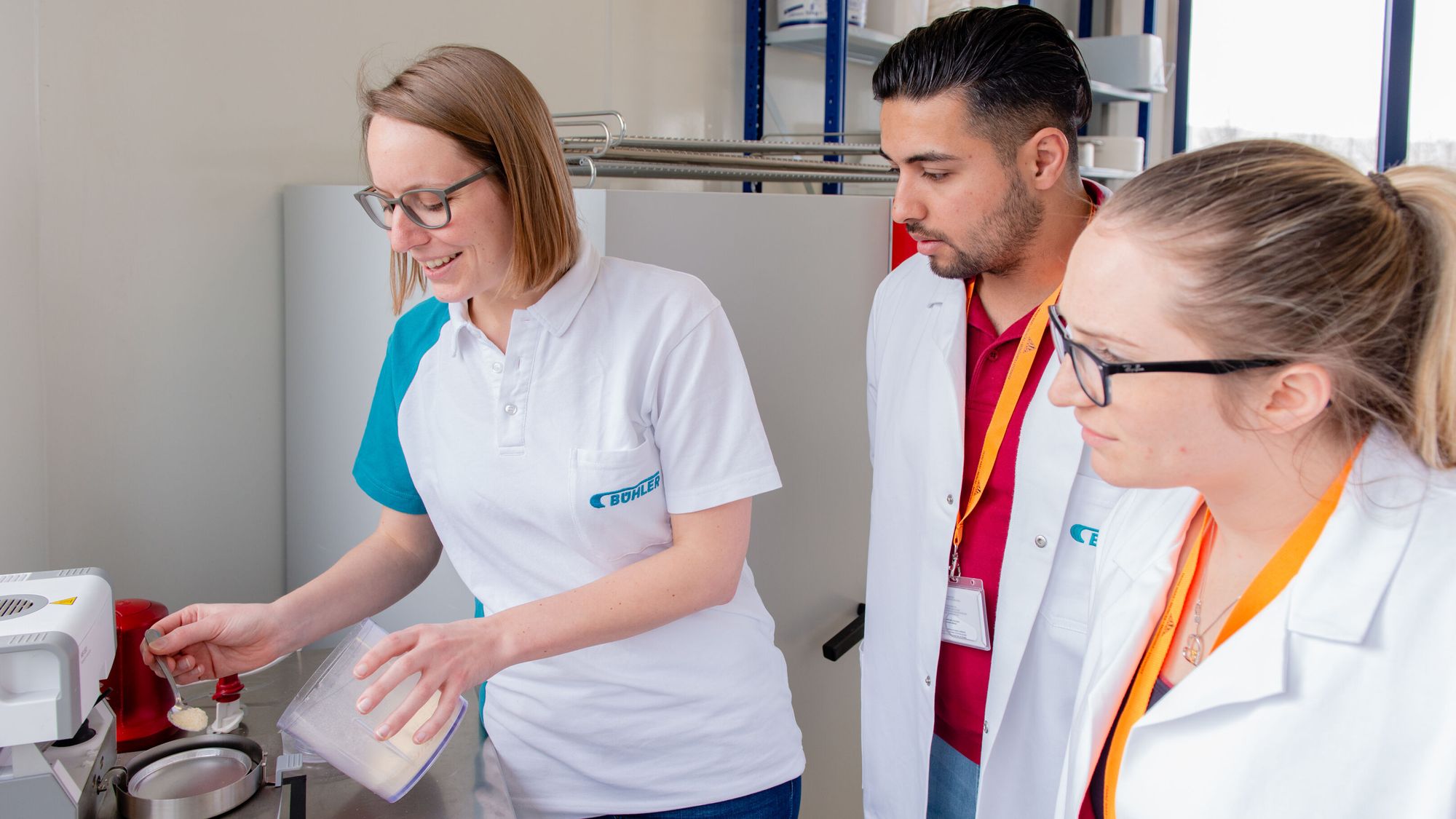 Bühler expert  and technologist measuring moisture with the moisture meter.