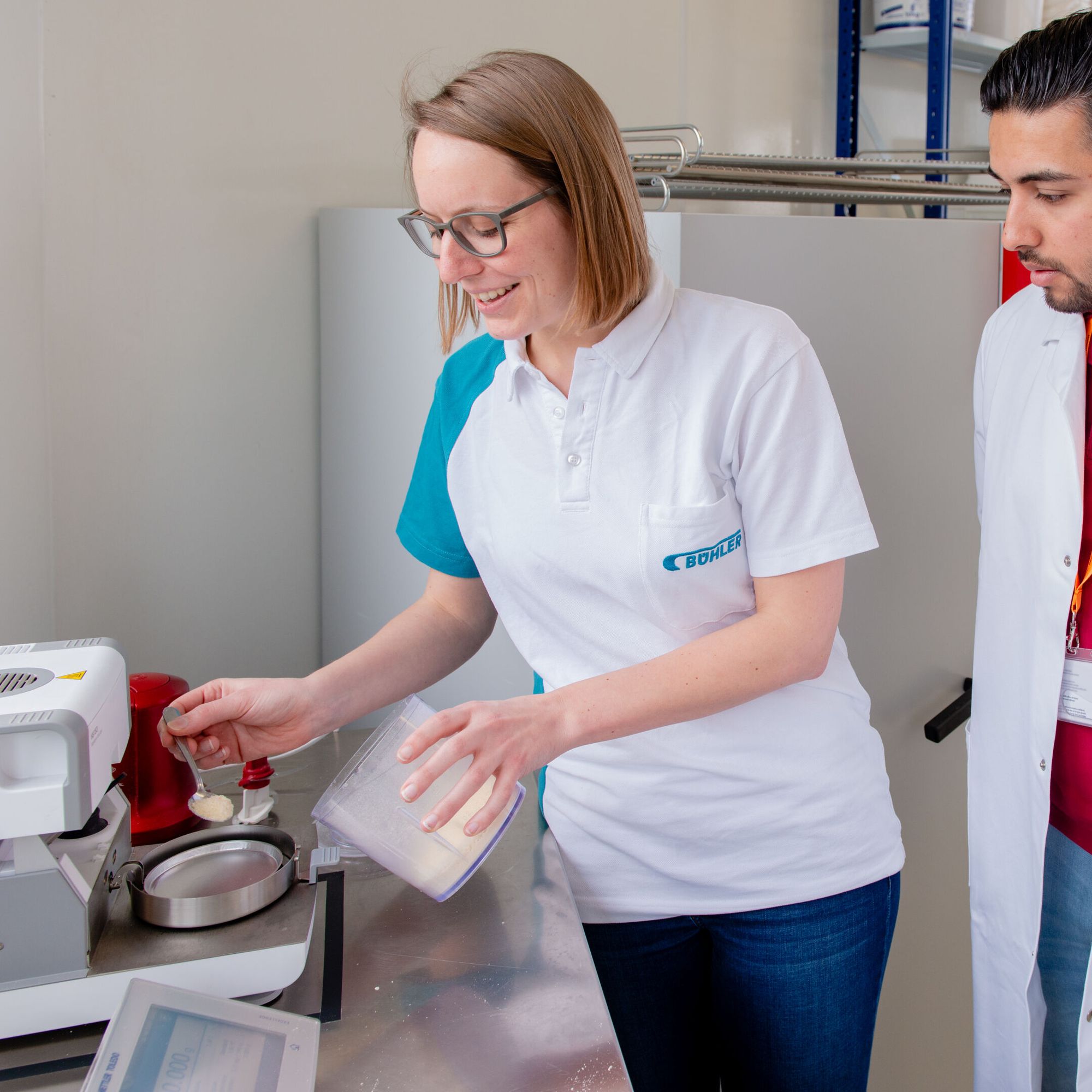 Bühler expert  and technologist measuring moisture with the moisture meter.